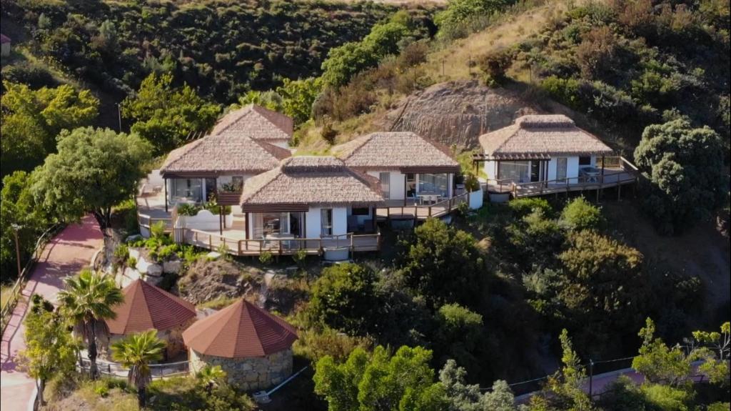 an aerial view of a house on a hill at Hotel Selwo Lodge - Animal Park Tickets Included in Estepona