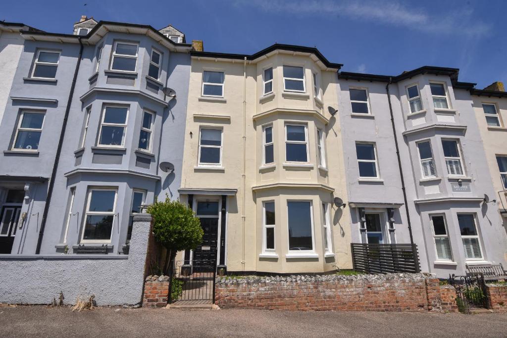 a row of houses in front of a street at Flat 2, 10 Seafield Road in Seaton