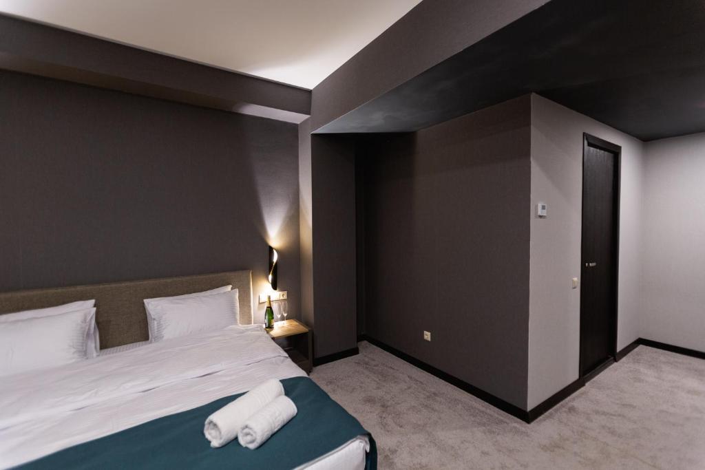 Postel nebo postele na pokoji v ubytování West Inn Georgia