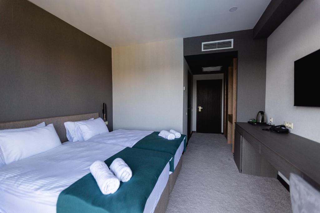 Postel nebo postele na pokoji v ubytování West Inn Georgia