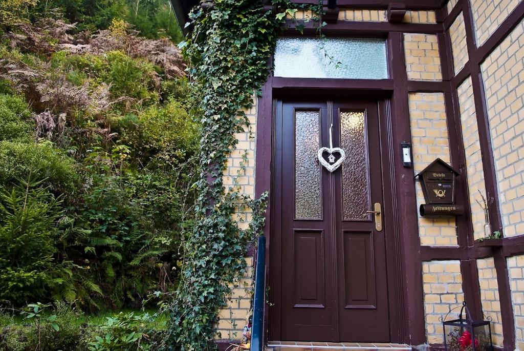 a door with a heart shaped door wreath on it at Appartmenthaus Wartburg in Bad Schandau