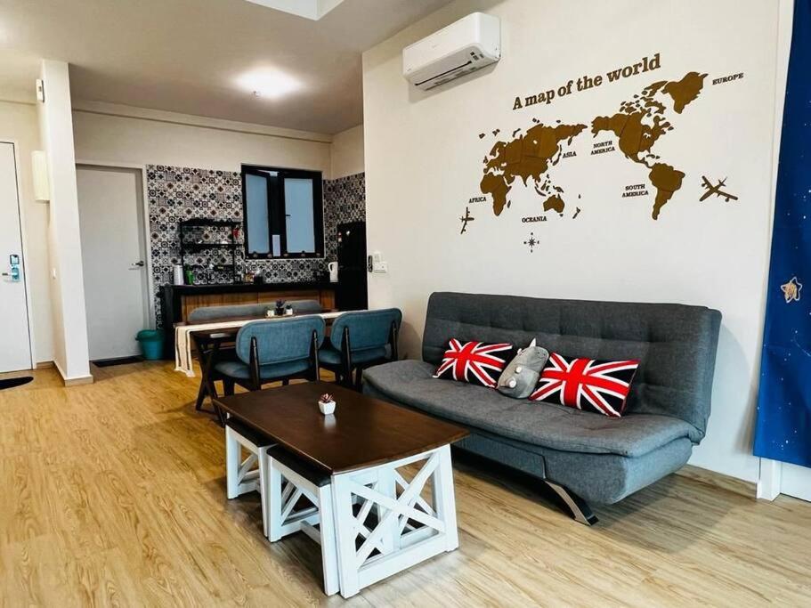 a living room with a couch and a table at Melaka Town/Sea View/10 min to Jonker/4-6Pax(2015) in Melaka