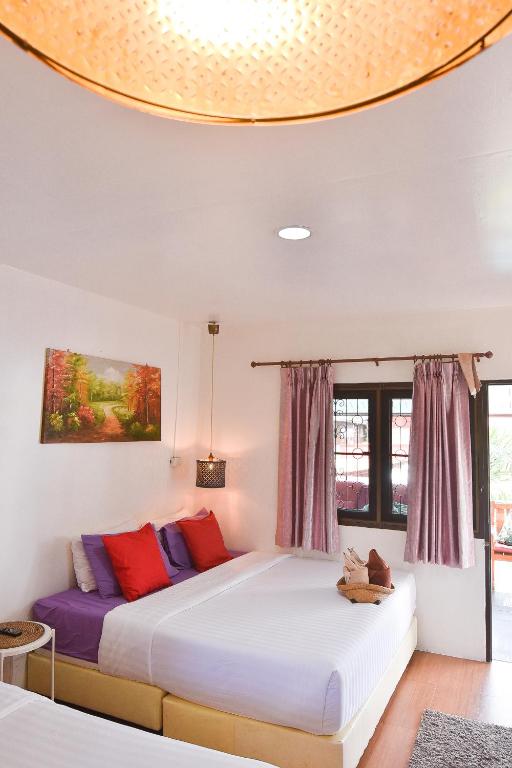 Postel nebo postele na pokoji v ubytování P.U. Inn Resort