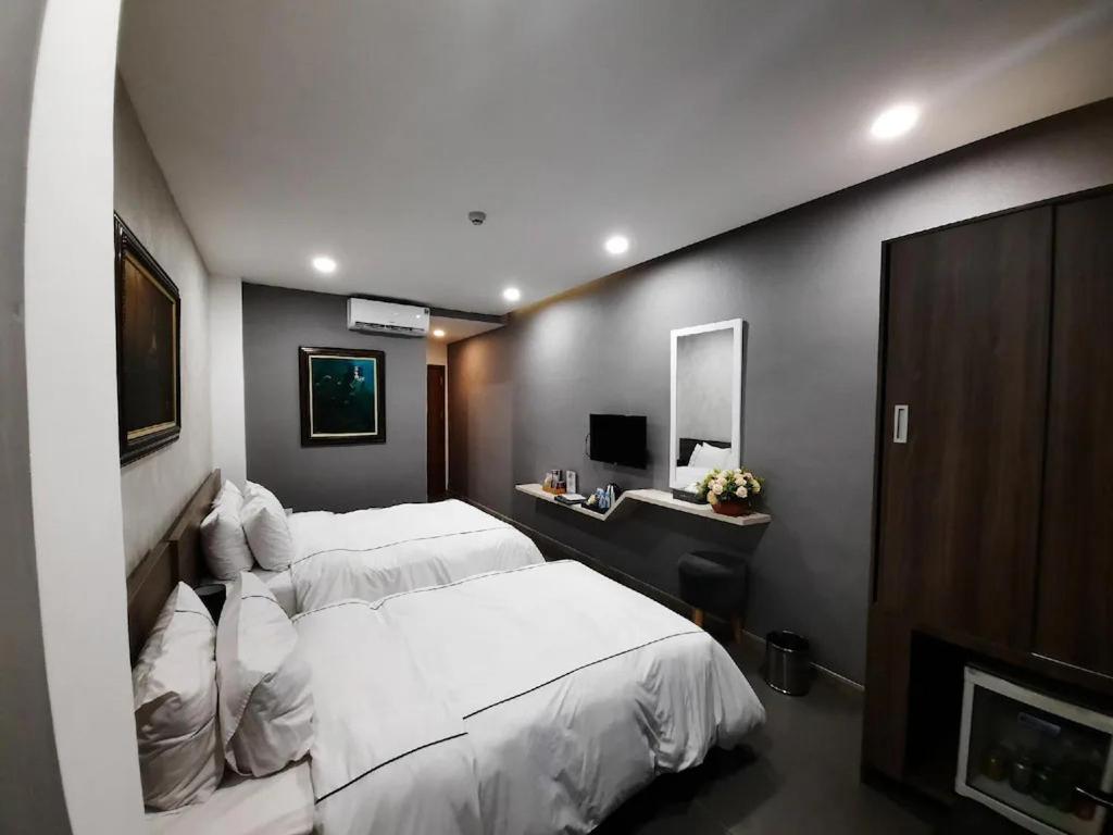 Ліжко або ліжка в номері Mia Hotel Ninh Thuận