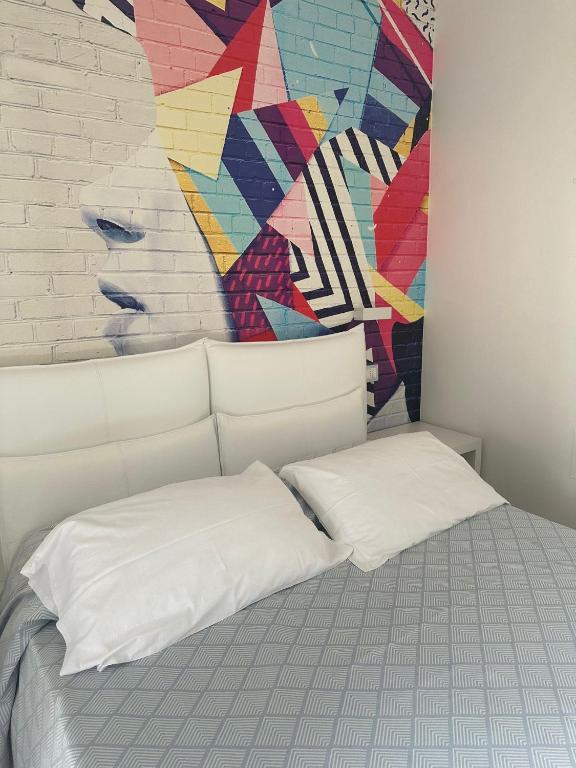 Łóżko lub łóżka w pokoju w obiekcie B&B Villa Fabrizia