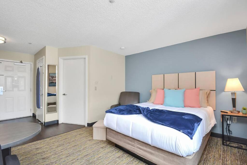 a large bedroom with a large bed and a table at Studio Apt: Heart of Houston in Houston