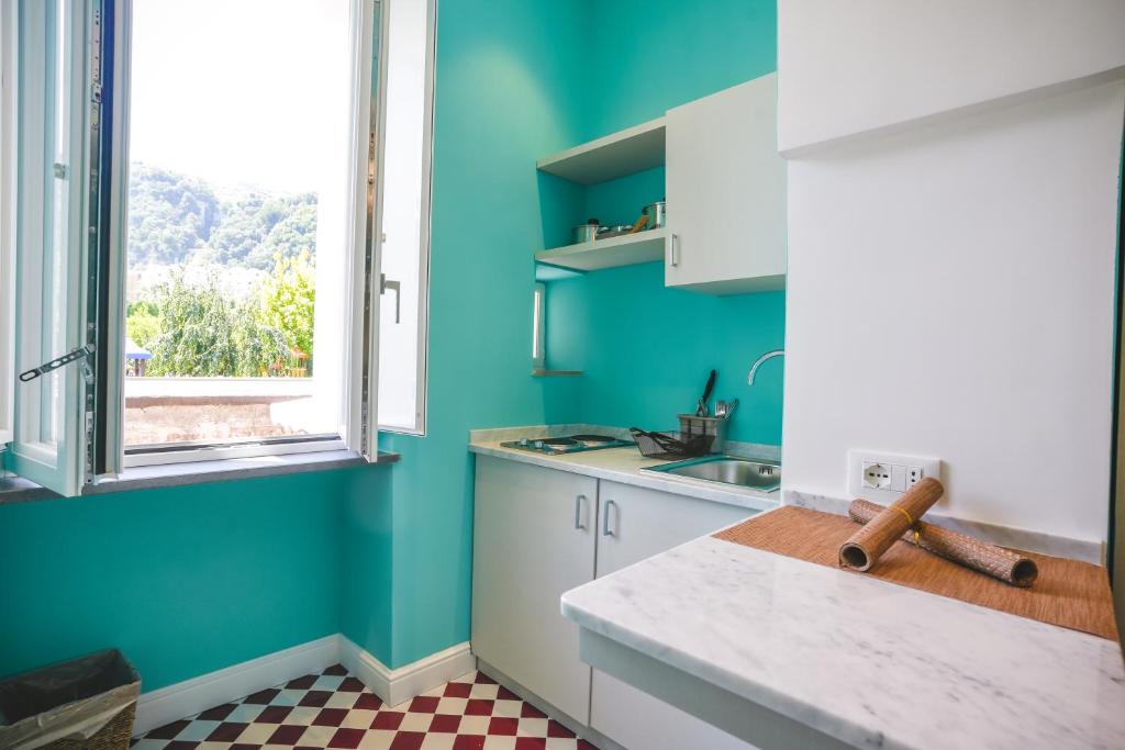 Kuchyň nebo kuchyňský kout v ubytování Cafè Latino Suites