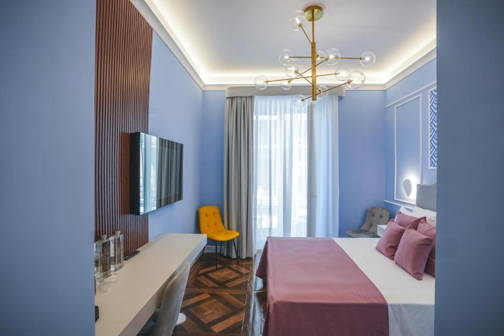 Postel nebo postele na pokoji v ubytování Cafè Latino Suites