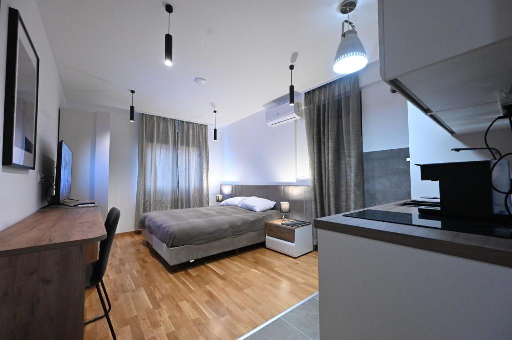TV a/nebo společenská místnost v ubytování Cozy and Lovely Apartments I & II