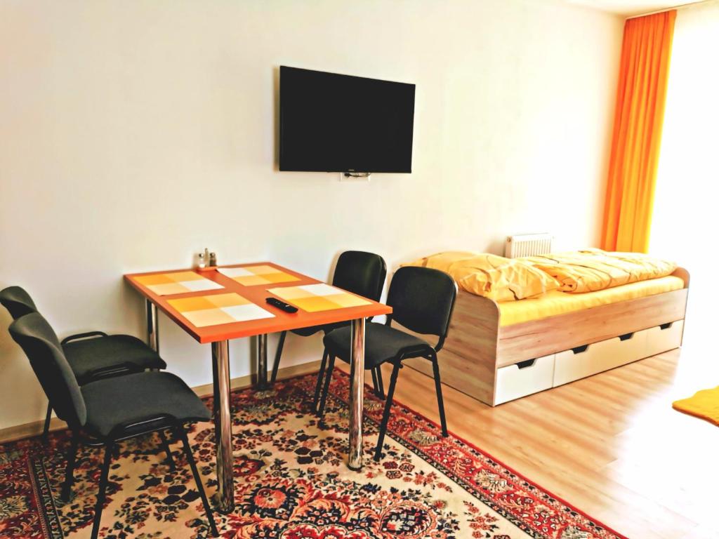 TV a/nebo společenská místnost v ubytování Comenius Apartments - Apartmány na rohu