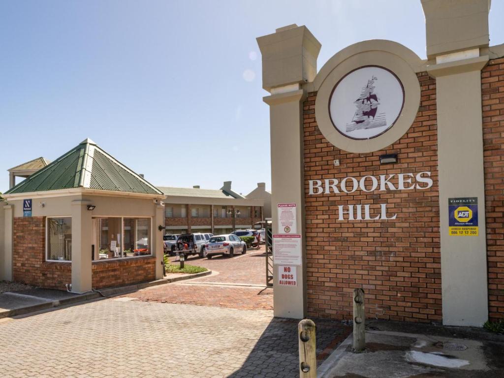 a brick building with a sign that reads brooks hill at GND Properties Luxury Apartment in Summerstrand