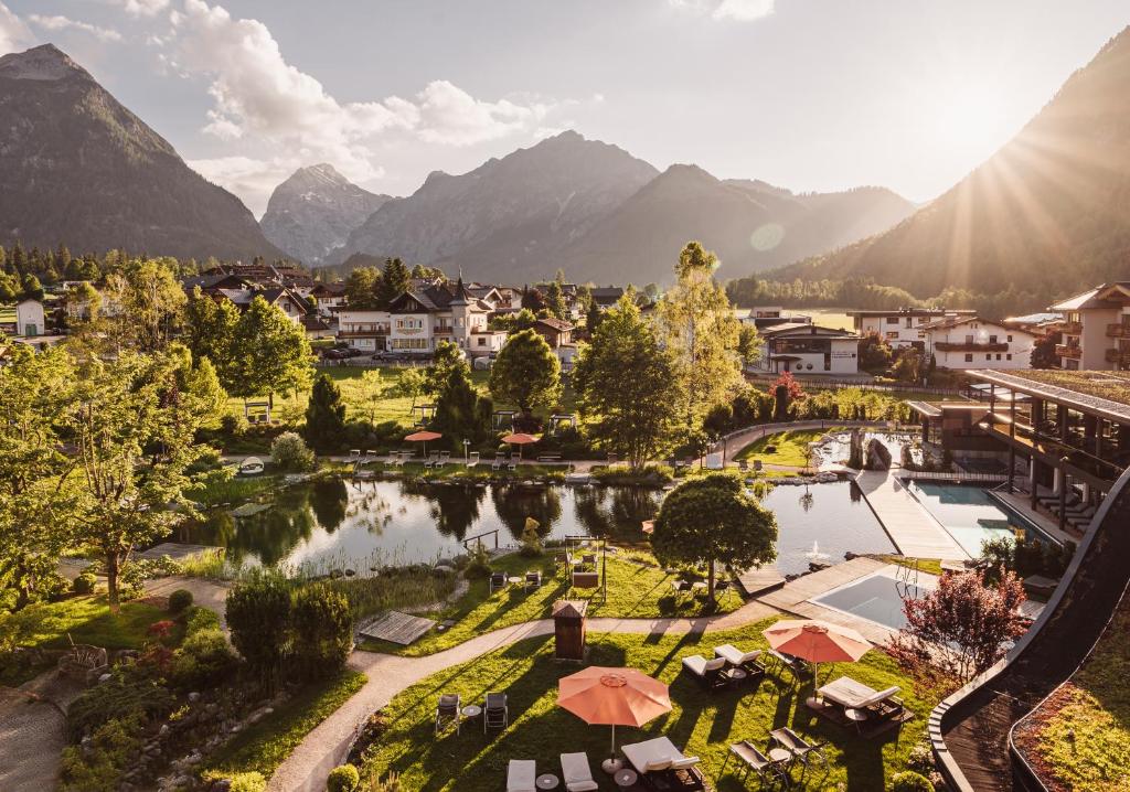 an aerial view of a resort with mountains in the background at Rieser Achensee Resort in Pertisau