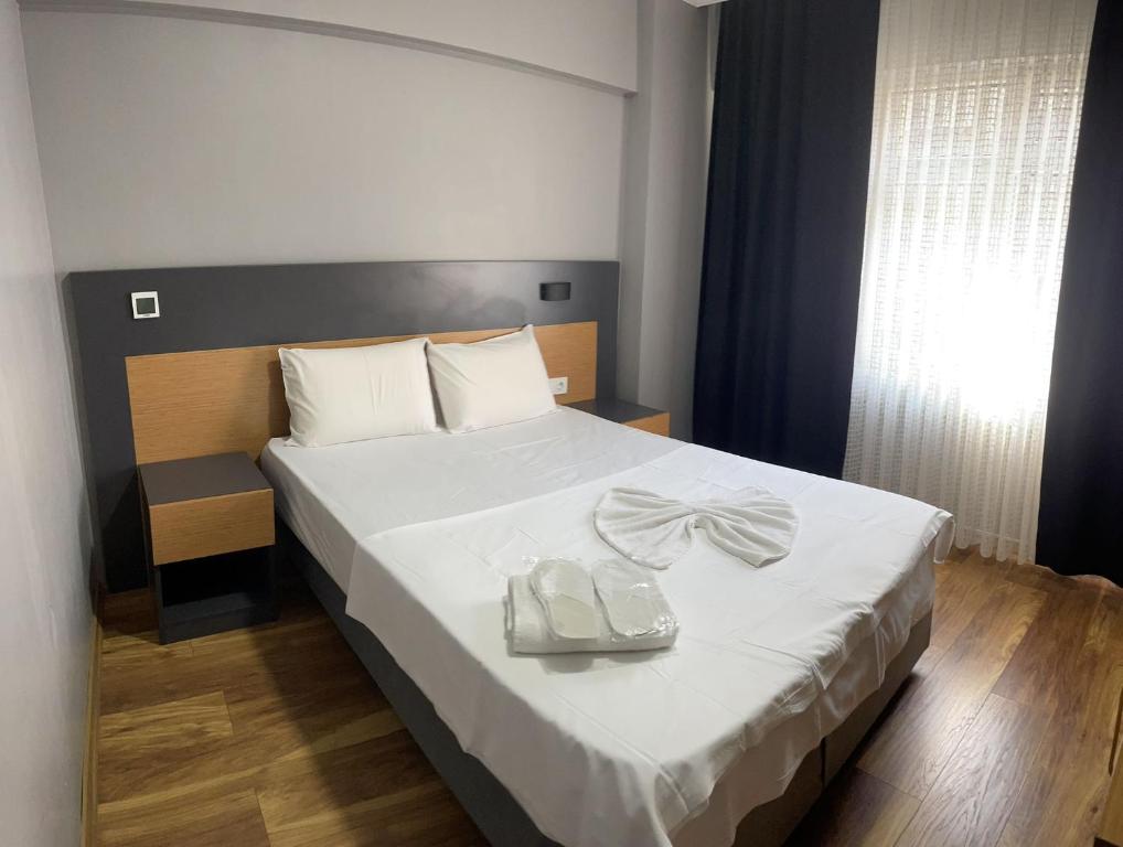 A bed or beds in a room at Hotel Otağ