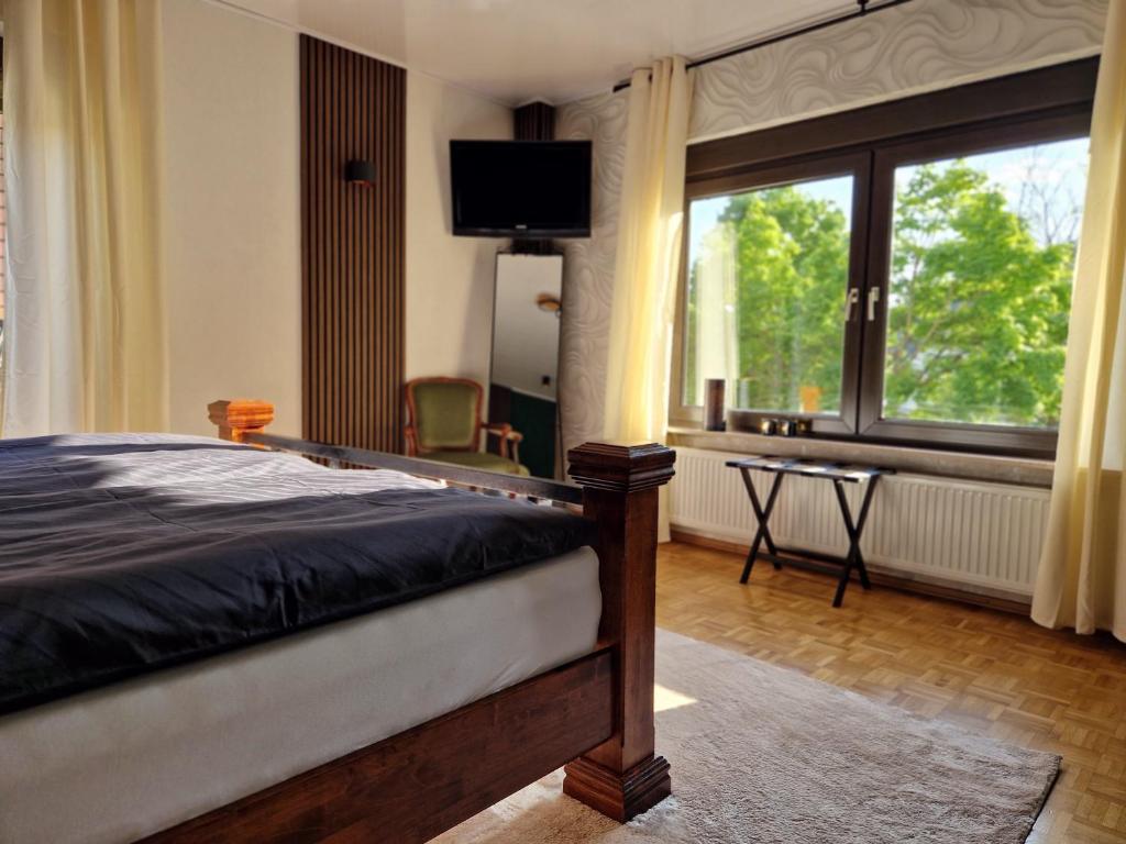 Postel nebo postele na pokoji v ubytování Ferienwohnung Waldliebe Hinterweidenthal