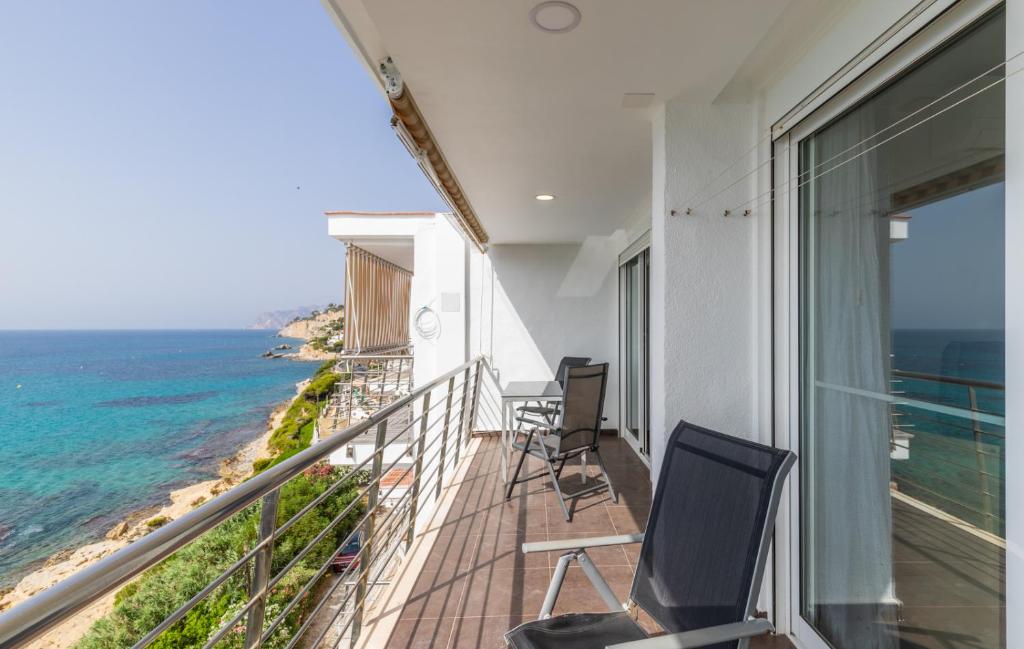 a balcony with chairs and a view of the ocean at Mar de Moravit by Nora Nice in Moraira