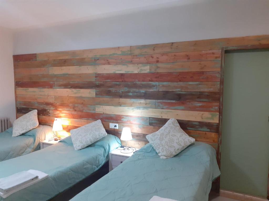 Postel nebo postele na pokoji v ubytování Hostal Can Massot