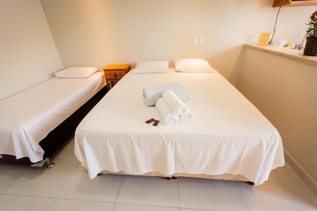 Postel nebo postele na pokoji v ubytování Suites em Jabaquara, Paraty