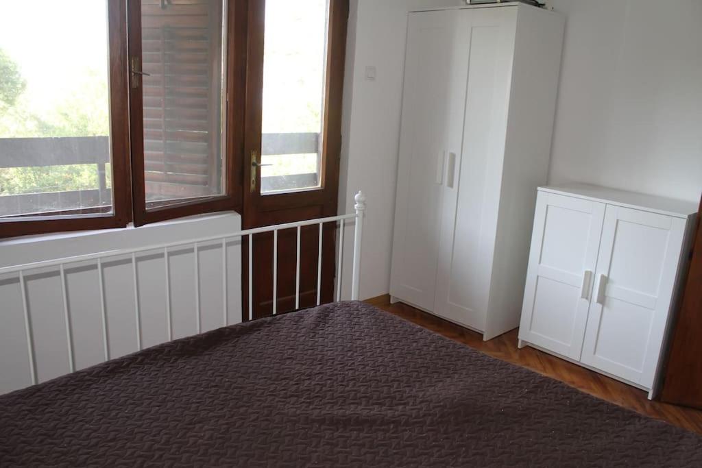Postel nebo postele na pokoji v ubytování Villa Hedonic