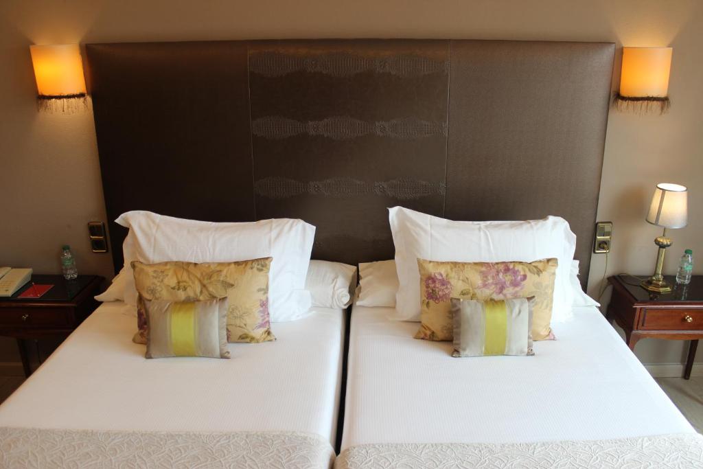 Postel nebo postele na pokoji v ubytování Hotel Ciudad de Vigo