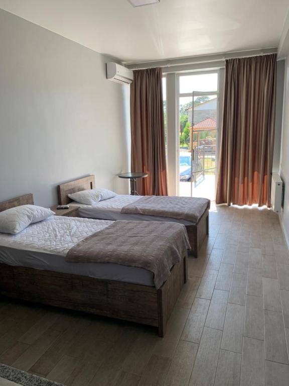 Postel nebo postele na pokoji v ubytování KARD HOUSE