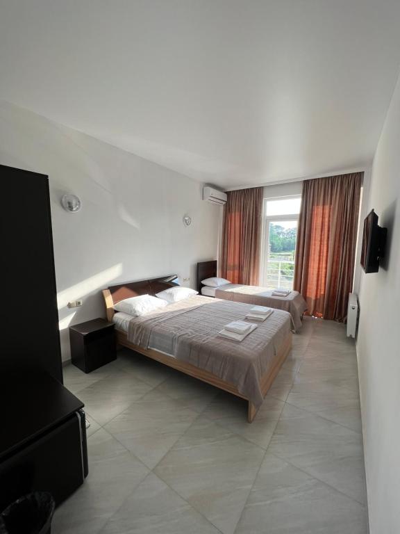 Postel nebo postele na pokoji v ubytování KARD HOUSE