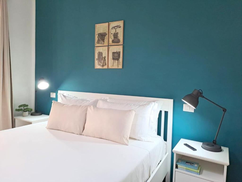 Posteľ alebo postele v izbe v ubytovaní Ajana Rooms by Accomodo