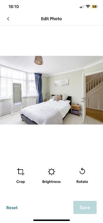 a comparison of a bedroom and a living room at Beautiful double bedroom in Hillingdon