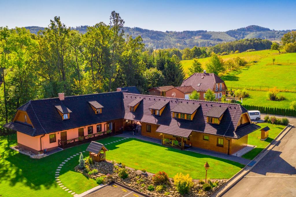 an aerial view of a large house with a yard at Penzion U Boženky in Rožnov pod Radhoštěm