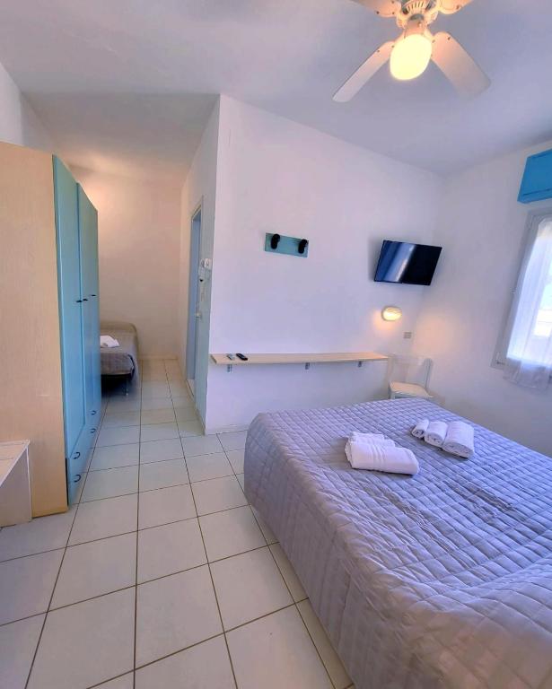 Postel nebo postele na pokoji v ubytování Hotel Roma