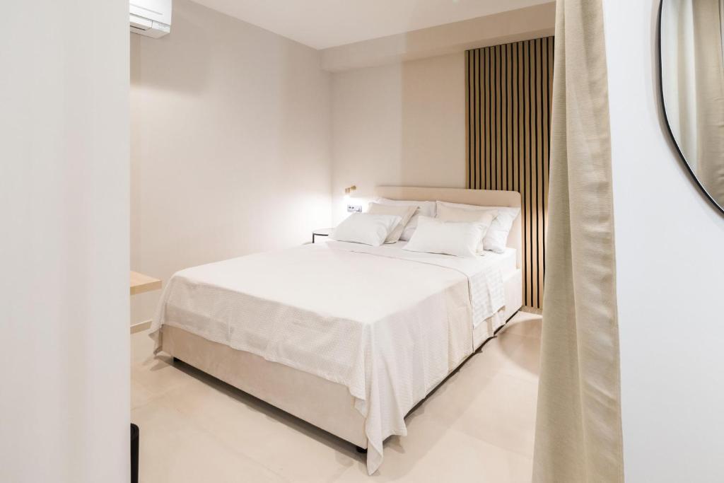 Postel nebo postele na pokoji v ubytování Tonio Rooms
