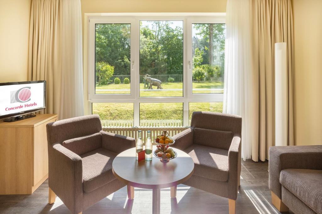 TV a/nebo společenská místnost v ubytování Concorde Hotel Viktoria