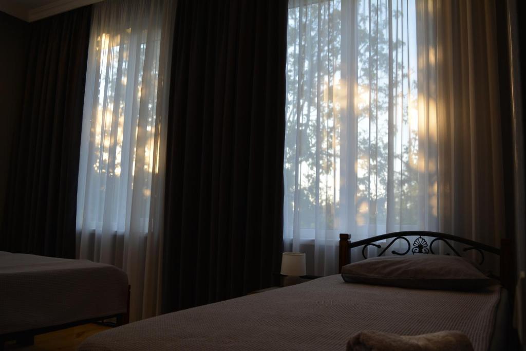 Postel nebo postele na pokoji v ubytování Velio Guest House