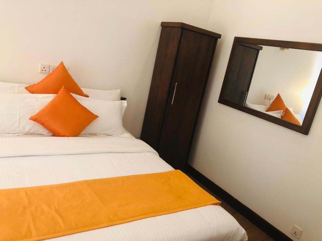 Postel nebo postele na pokoji v ubytování Andora Nuwara Eliya
