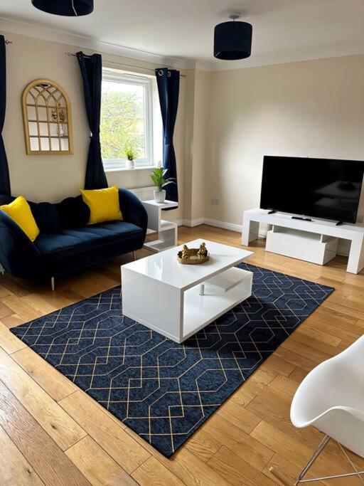 a living room with a couch and a coffee table at JB Stays Croydon Townhouse in South Norwood