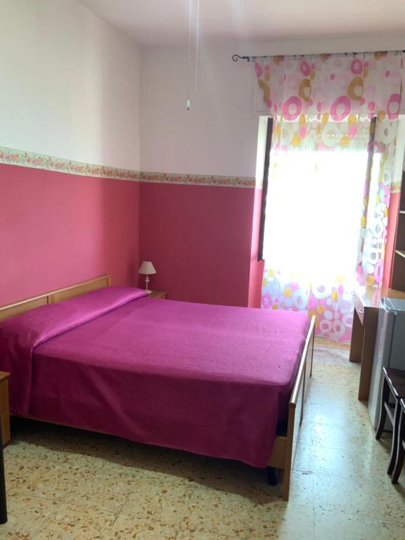 Postel nebo postele na pokoji v ubytování La Scogliera Bed & Breakfast