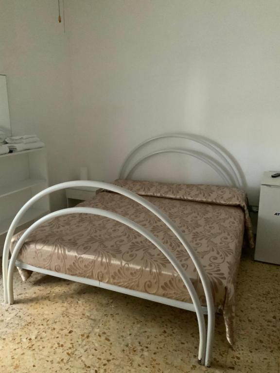 Postel nebo postele na pokoji v ubytování La Scogliera Bed & Breakfast