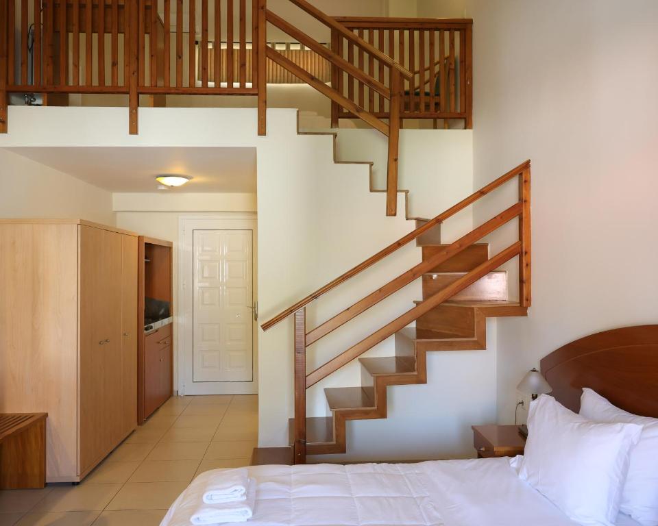 Postel nebo postele na pokoji v ubytování Corinthian Village