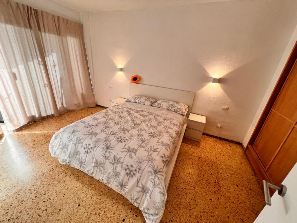 A bed or beds in a room at Agaete Parque Av de Tenerife Maspalomas