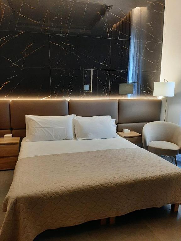 Letto o letti in una camera di BAARIA House Hotel