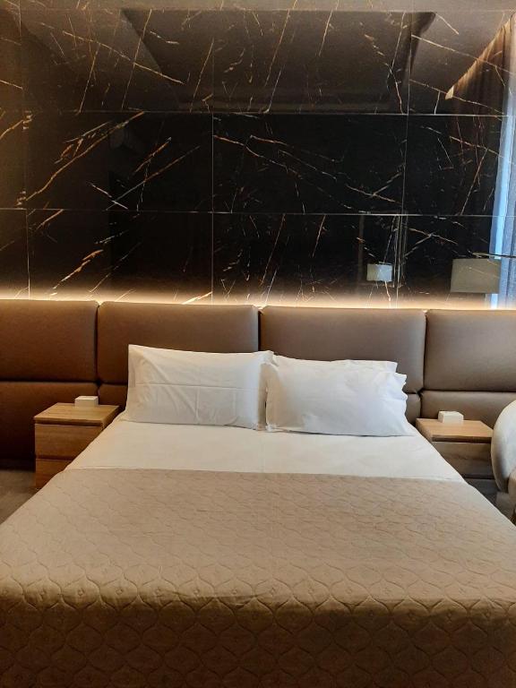 Letto o letti in una camera di BAARIA House Hotel