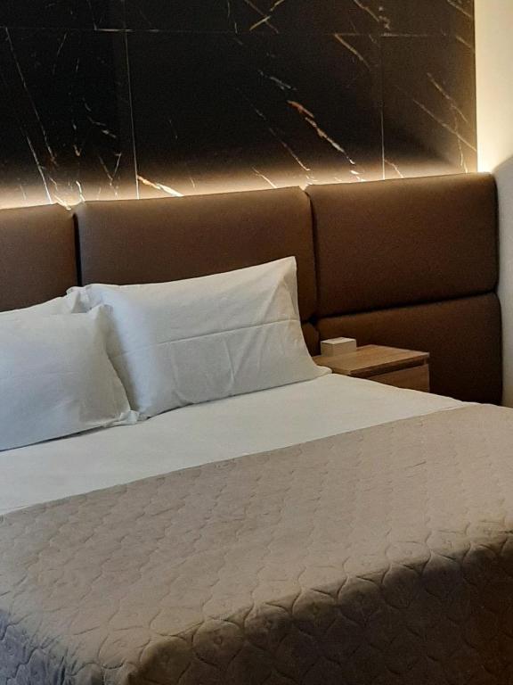 Letto o letti in una camera di BAARIA House Hotel