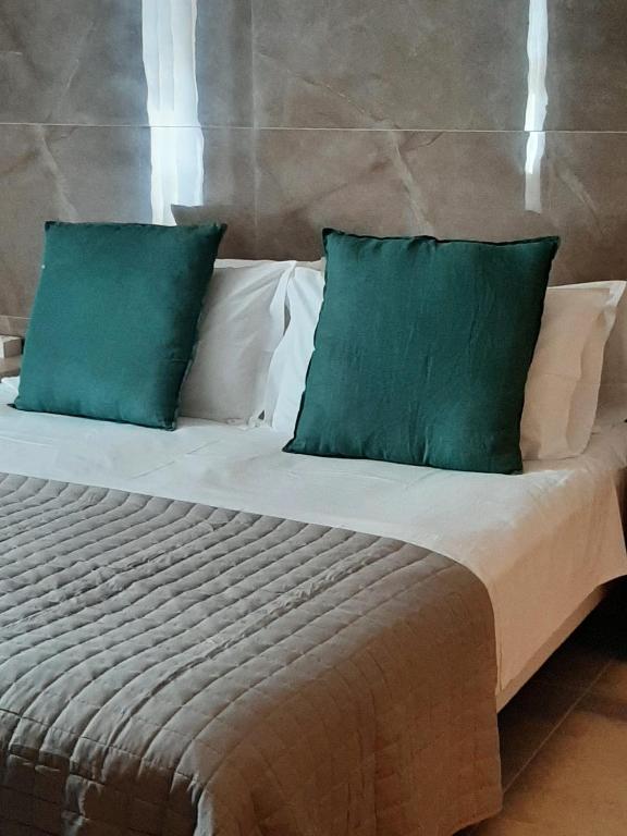 Letto o letti in una camera di BAARIA House Hotel