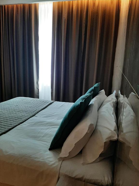 Letto o letti in una camera di BAARIA House Hotel