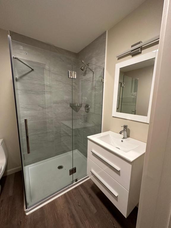a bathroom with a shower and a sink at Crater Lake Gateway - Hwy 140 in Klamath Falls