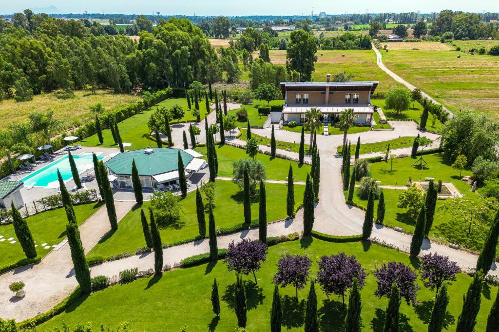 an aerial view of a garden with a house and a pool at Casale Delle Ronde B&B in Latina