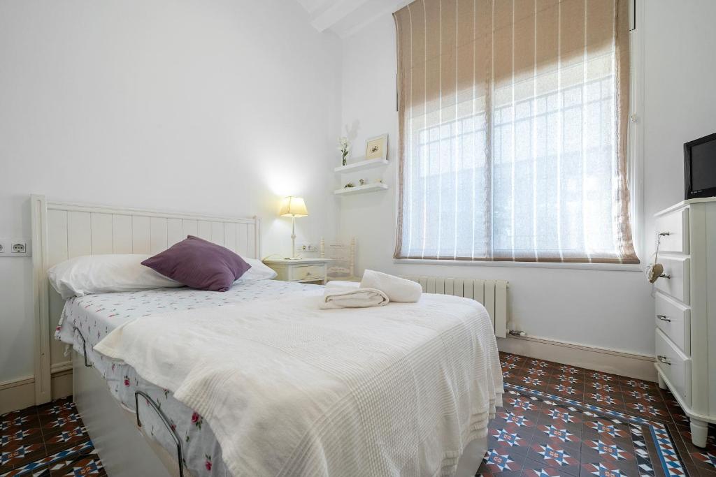 Posteľ alebo postele v izbe v ubytovaní Hauzify I Casa d'Anselm Clavé