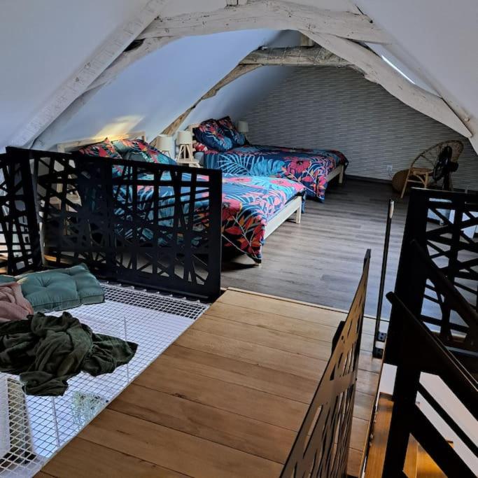 Postel nebo postele na pokoji v ubytování L'Atelier Gîte-Loft 6/8 pers