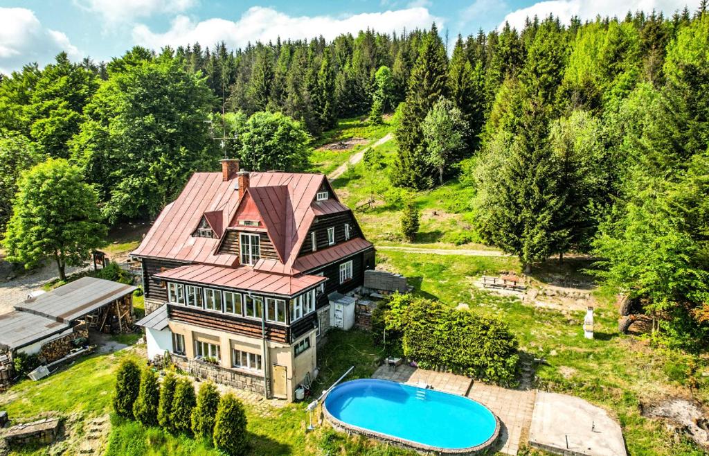 an aerial view of a house with a swimming pool at Horská Chata Gírová in Bukovec