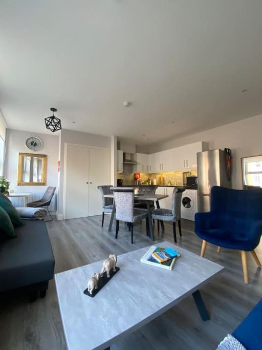 a living room with a couch and a table at Cosy and central Abbey Street Apt in Dublin