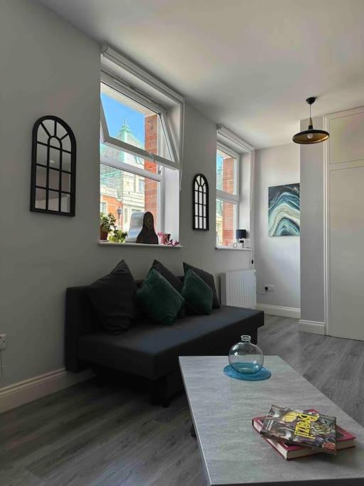 a living room with a couch and a table at Central 2-bed Apartment in Dublin